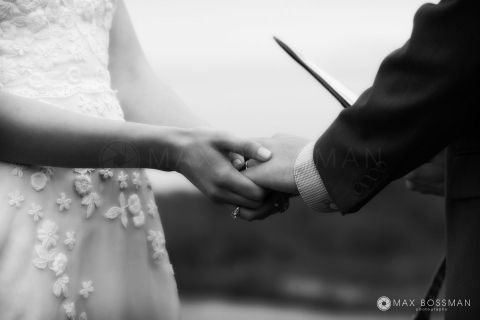 Bride and groom holding hands wedding ceremony in Chilmark Martha&#039;s Vineyard